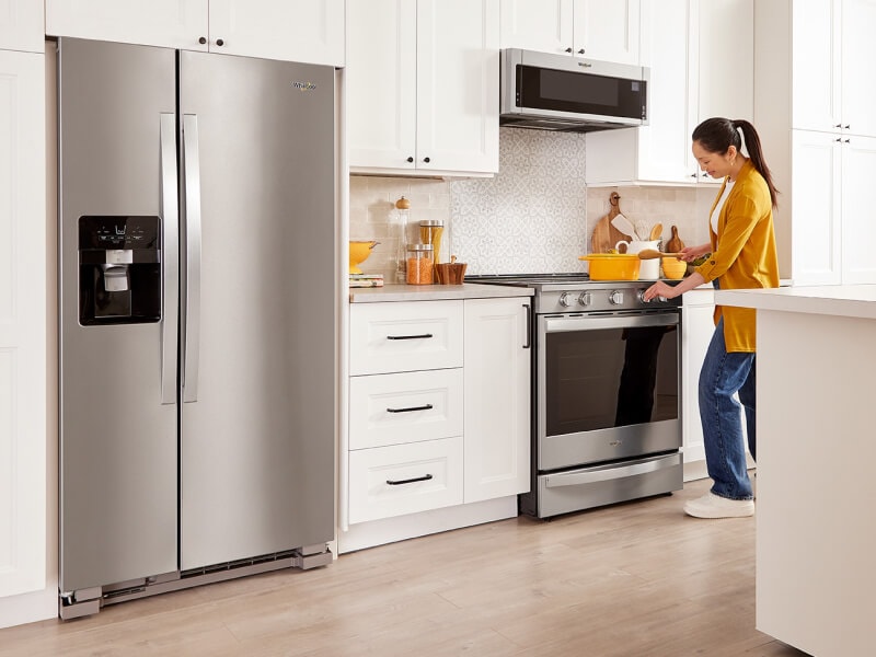 A person cooking at their stovetop A person cooking at their stovetop