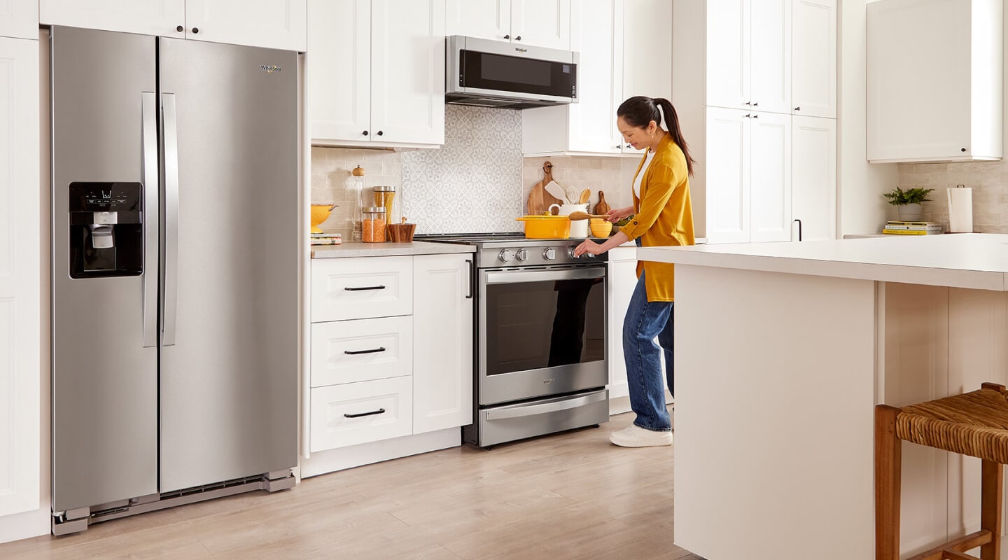 A person cooking at their stovetop A person cooking at their stovetop