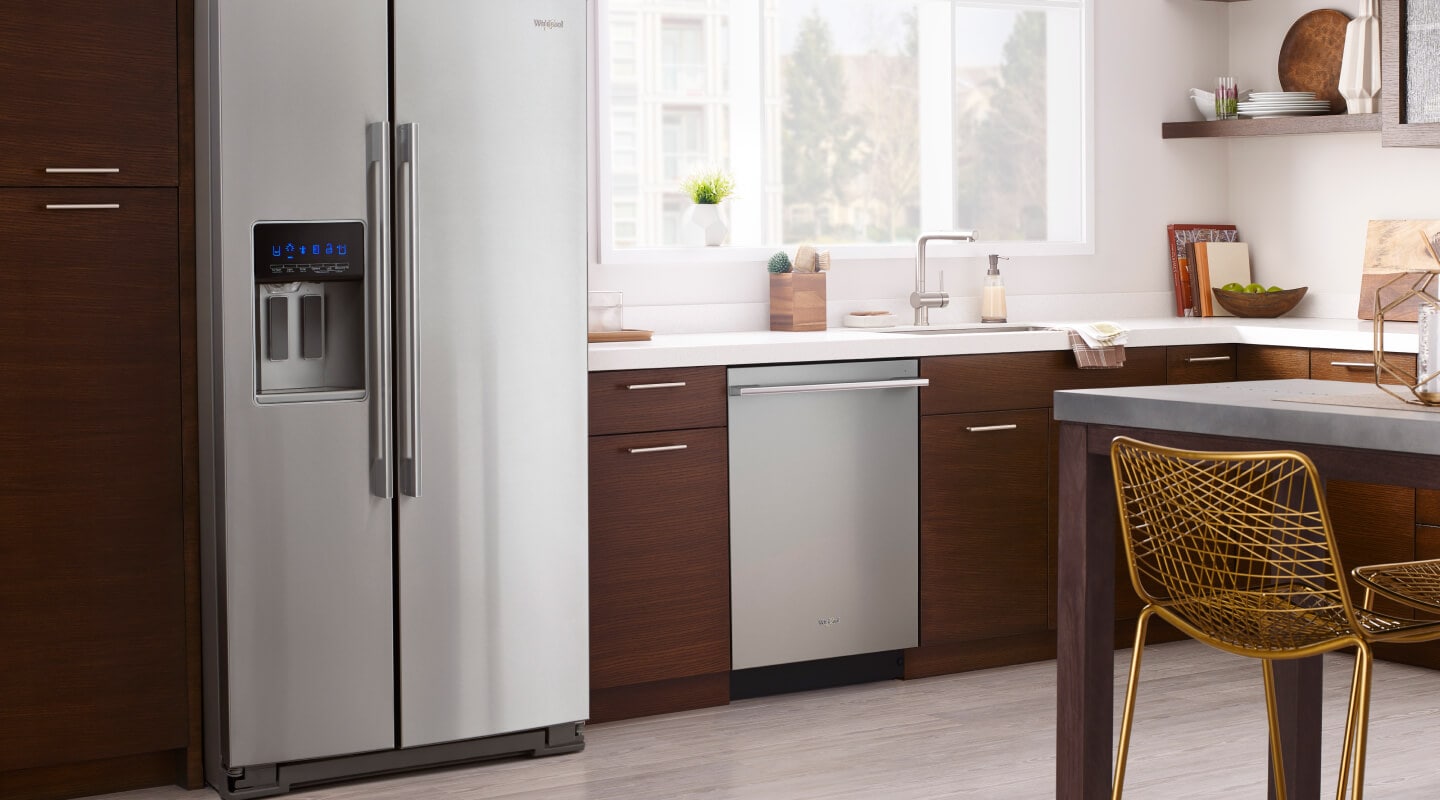 A modern wood cabinet kitchen with a counter depth refrigerator A modern wood cabinet kitchen with a counter depth refrigerator