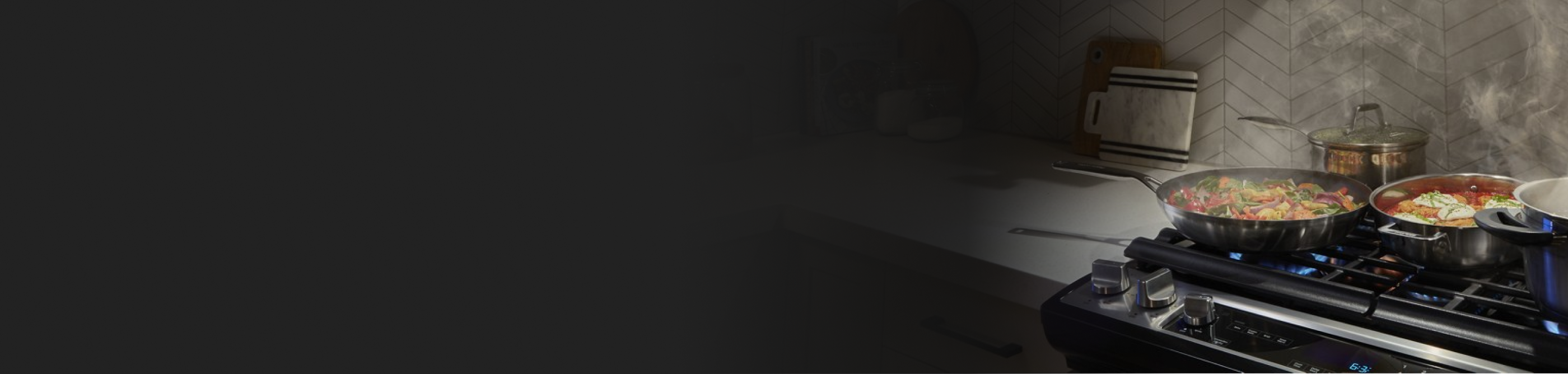 Various dishes cooking on the cooktop of a gas range