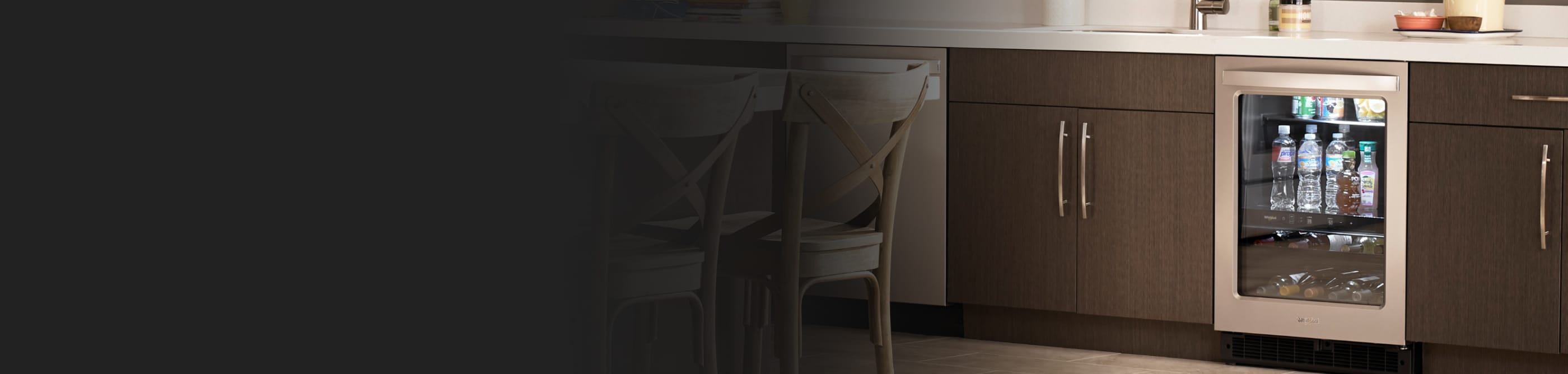 Interior of a kitchen with an undercounter fridge installed