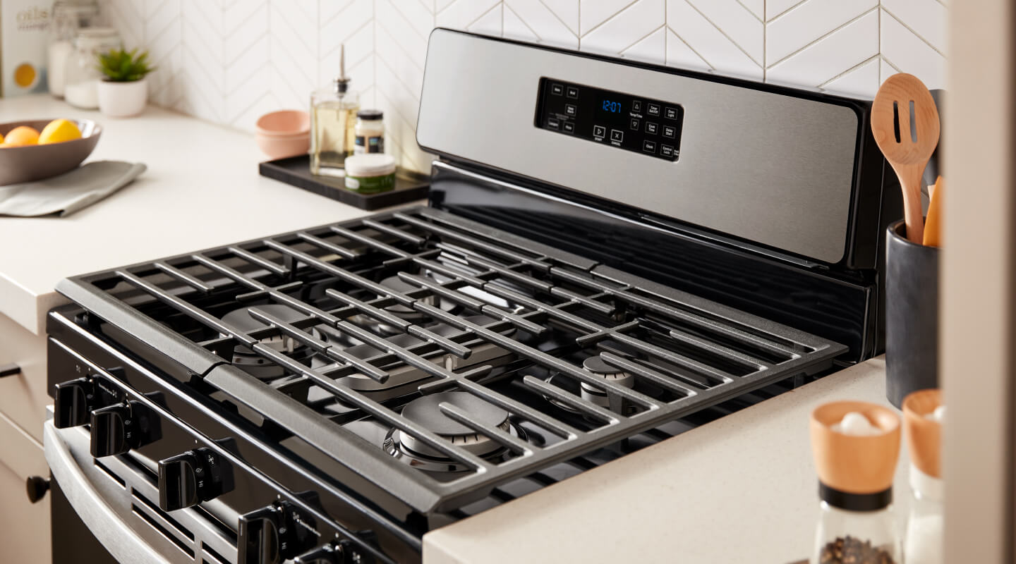 A Whirlpool® Gas Range in a white, bright kitchen