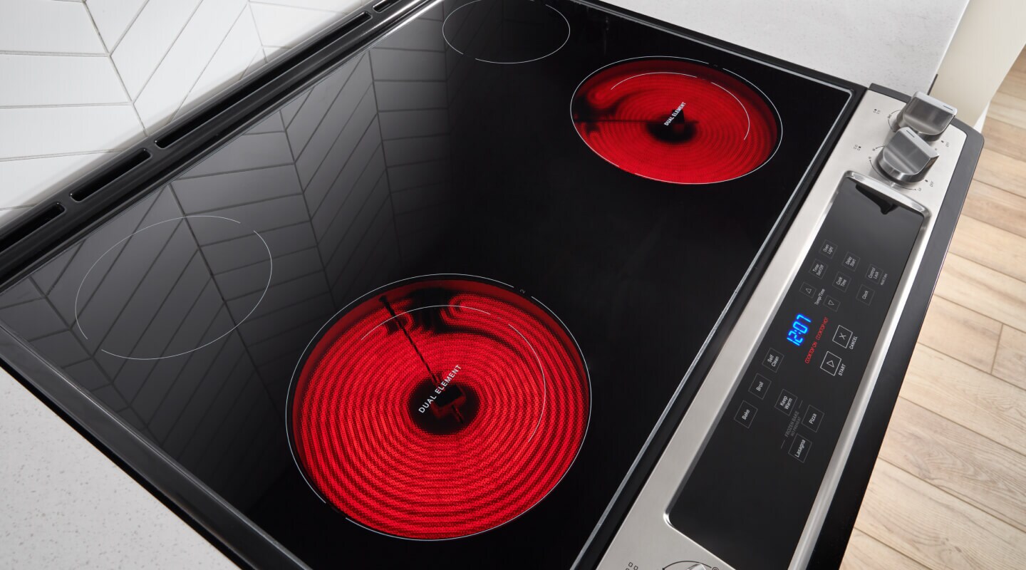 A glass surface stovetop with two burners warm A glass surface stovetop with two burners warm