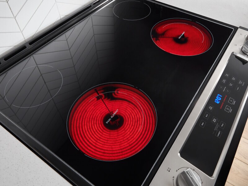 A glass surface stovetop with two burners warm A glass surface stovetop with two burners warm