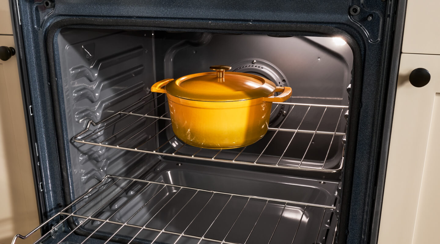 A Dutch Oven pot sitting in an open oven A Dutch Oven pot sitting in an open oven