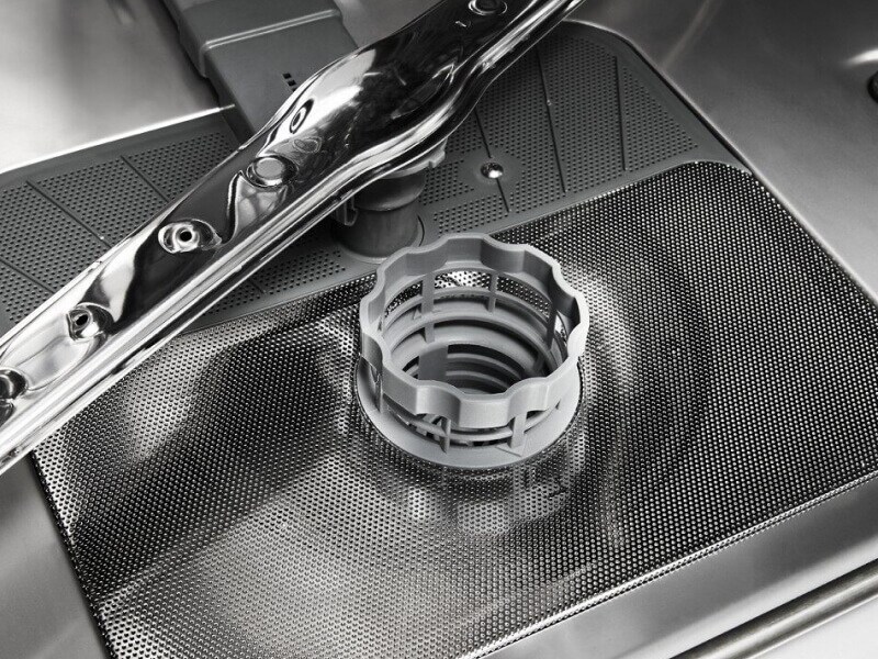 A clean dishwasher filter and spray arm A clean dishwasher filter and spray arm