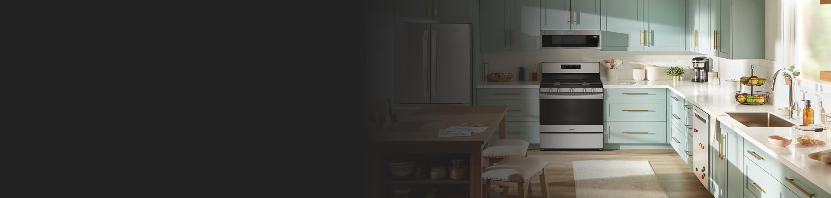 A bright kitchen with blue cabinets and white countertops