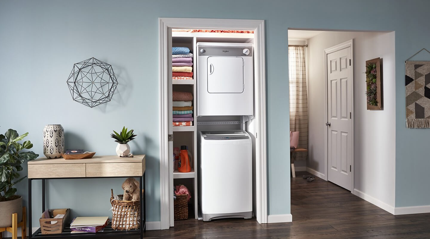 Top load washer and front load dryer mounted in a laundry closet Top load washer and front load dryer mounted in a laundry closet