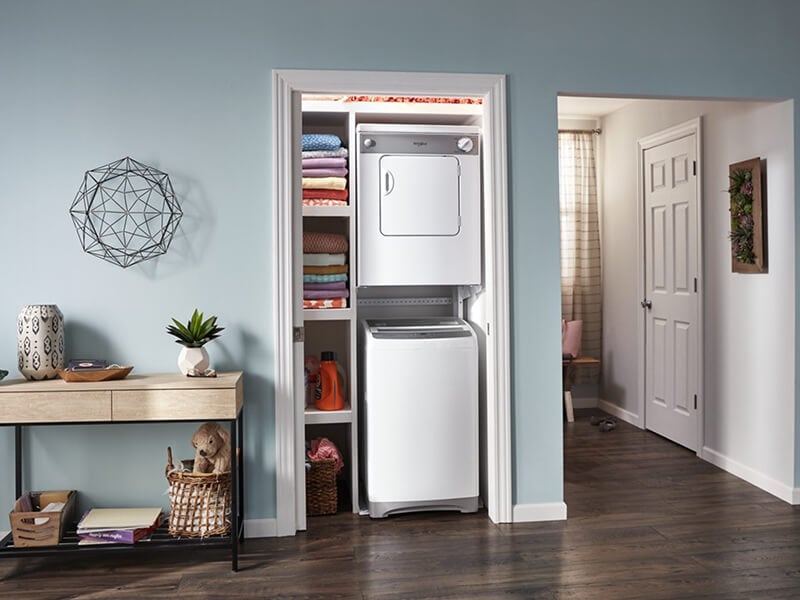Top load washer and front load dryer mounted in a laundry closet Top load washer and front load dryer mounted in a laundry closet