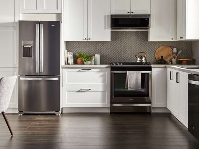 Bright kitchen with stainless steel appliances Bright kitchen with stainless steel appliances