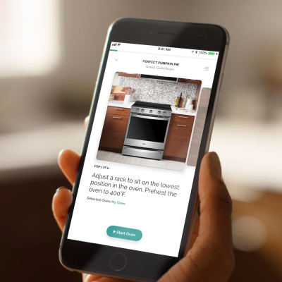 Person sending multiple-step recipe instructions to an oven