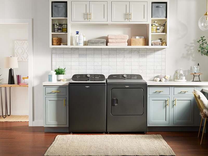 Whirlpool® Washer and Dryer side by side in a laundry room