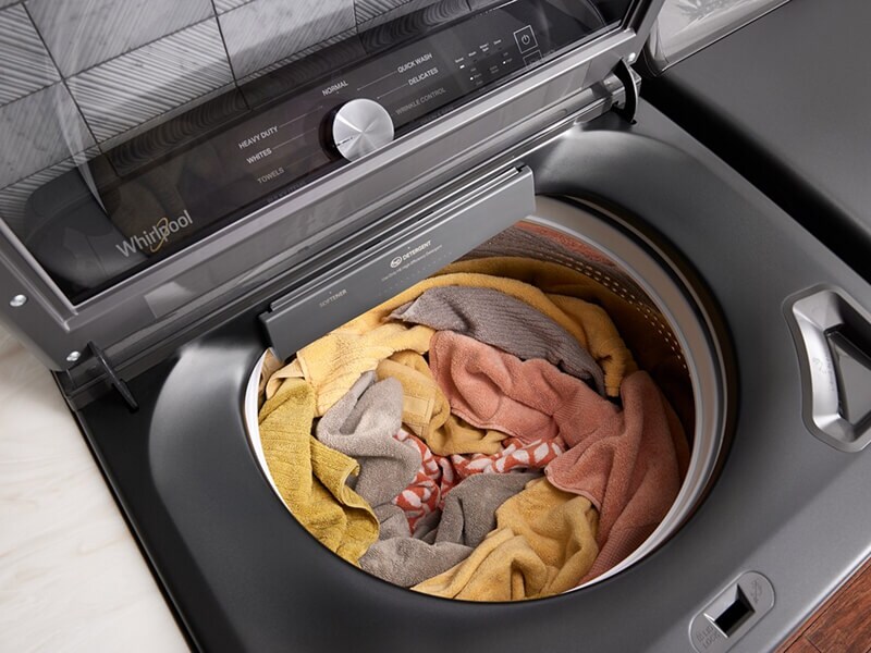 Overhead view of a load of rags and towels in a washing machine Overhead view of a load of rags and towels in a washing machine