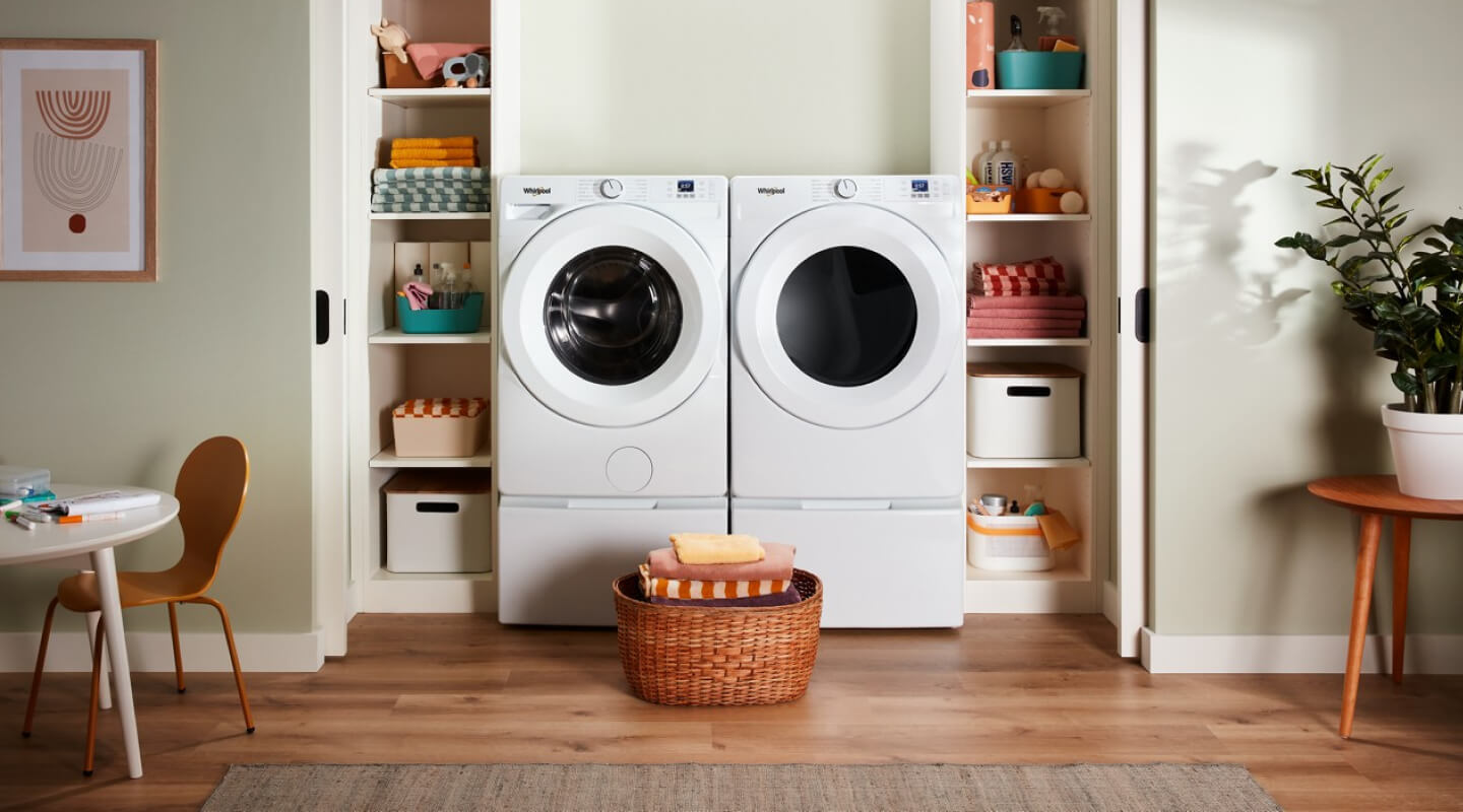 Whirlpool® Front Load Washer and Dryer in a modern laundry room