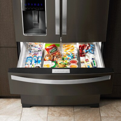 Bottom freezer open to show contents