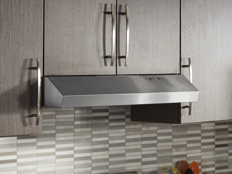 Undercabinet hood installed beneath modern wood cabinets Undercabinet hood installed beneath modern wood cabinets