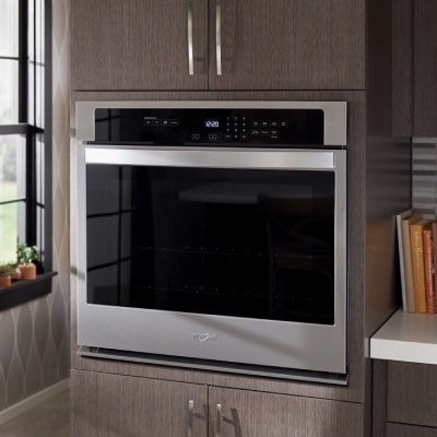 Stainless steel Whirlpool® wall oven in a modern kitchen