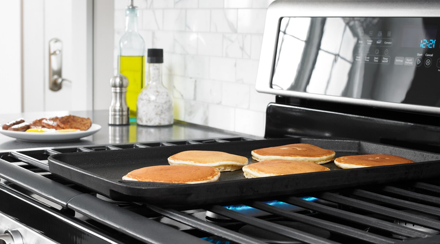 Pancakes cooking on a Whirlpool® gas range Pancakes cooking on a Whirlpool® gas range