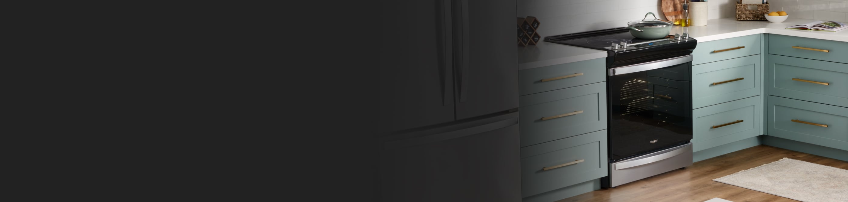 Whirlpool® electric range in a kitchen with teal cabinets