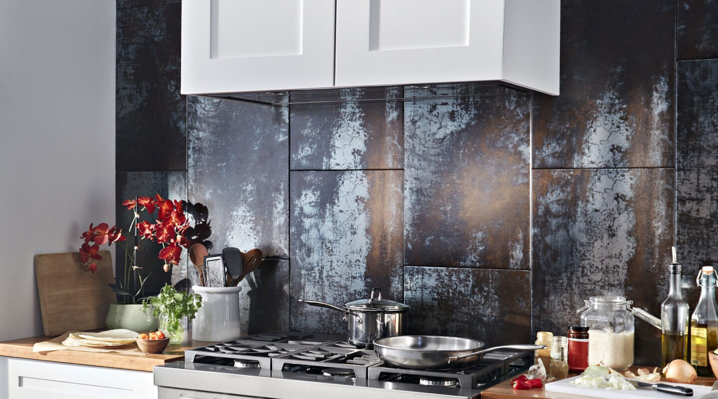 A range hood liner with ingredients on a counter nearby.