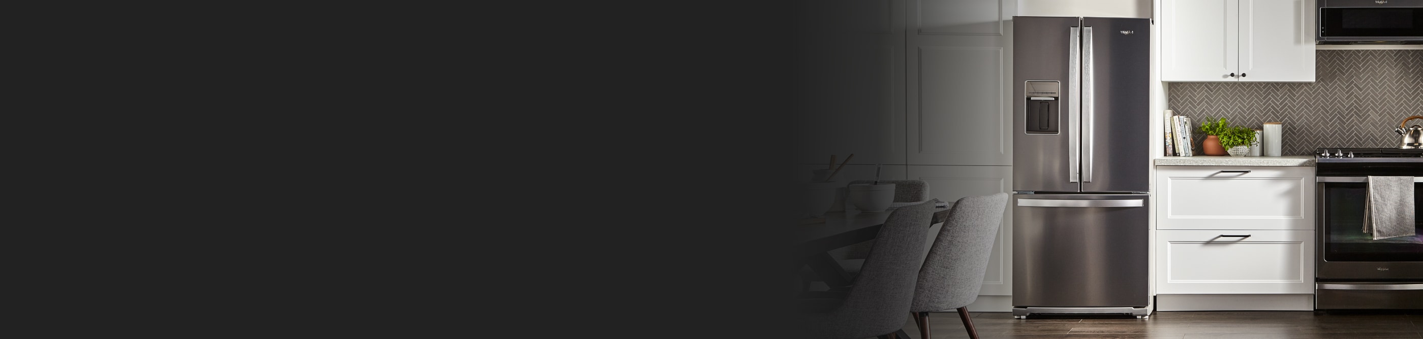 Modern kitchen with white cabinets and Whirlpool® stainless steel French door refrigerator and Whirlpool® range