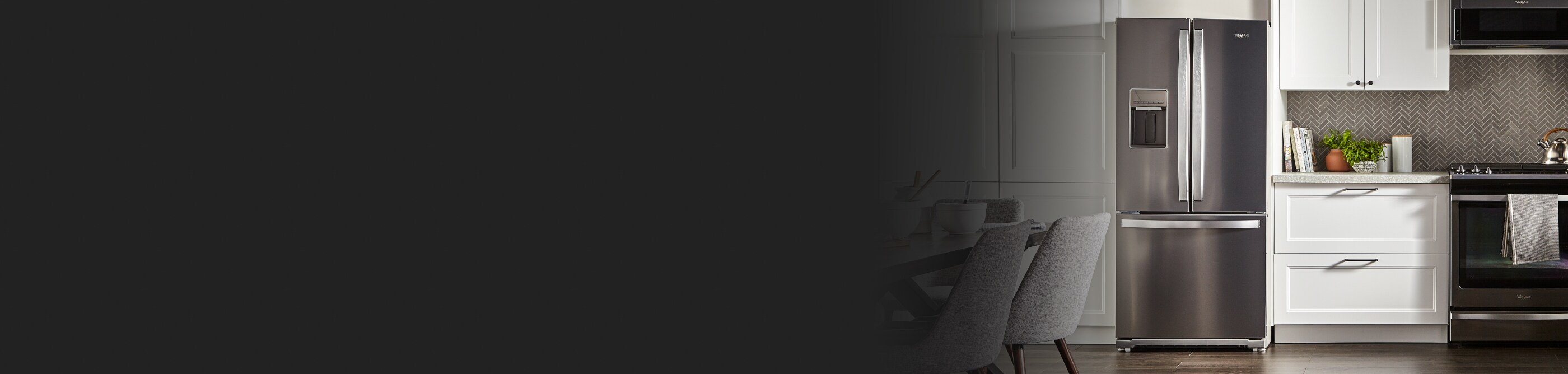 Modern kitchen with white cabinets and Whirlpool® stainless steel French door refrigerator and Whirlpool® range