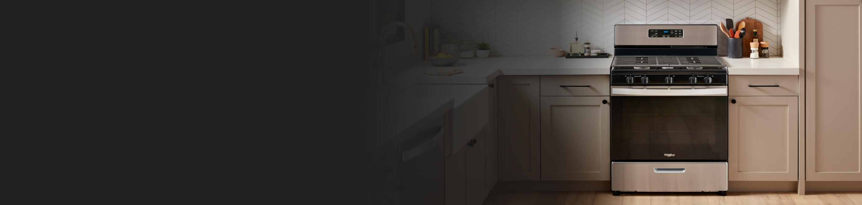 A Whirlpool® Range surrounded by tan cabinetry