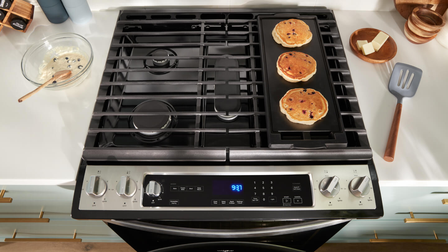Pancakes cooking on a griddle