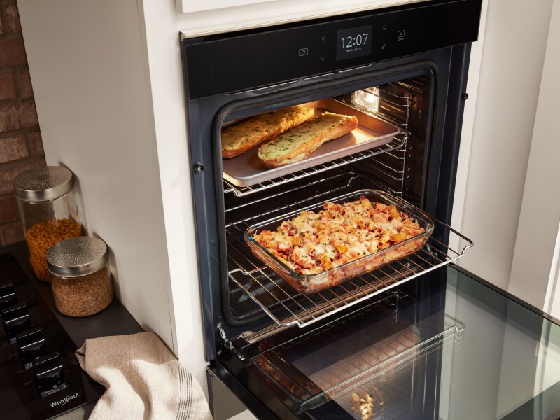 Various dishes cooking in a single wall oven Various dishes cooking in a single wall oven