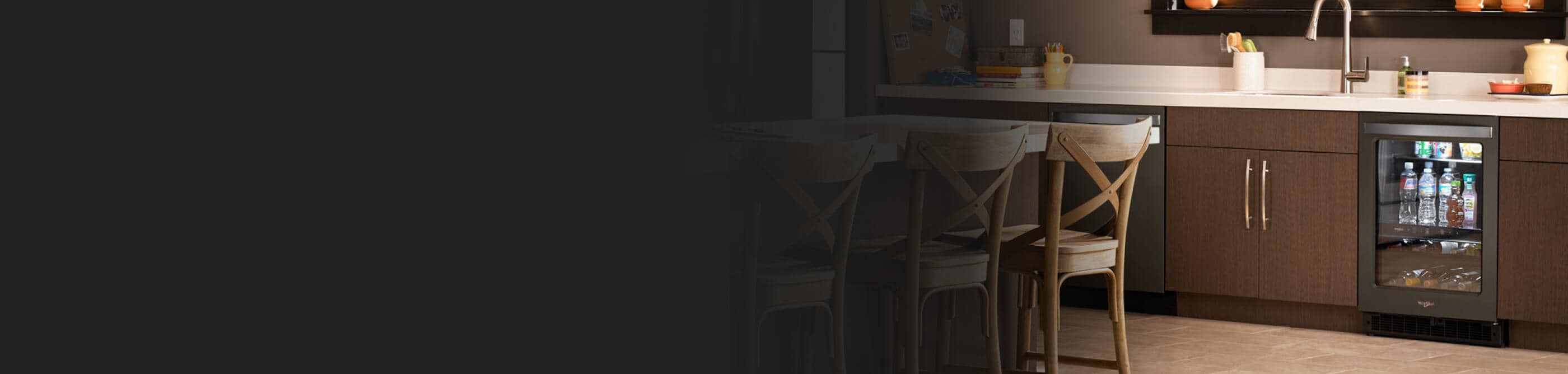 Black beverage cooler underneath countertops