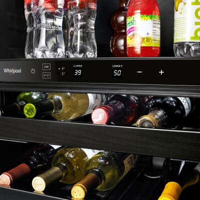 Wine bottles and miscellaneous beverages in an undercounter fridge