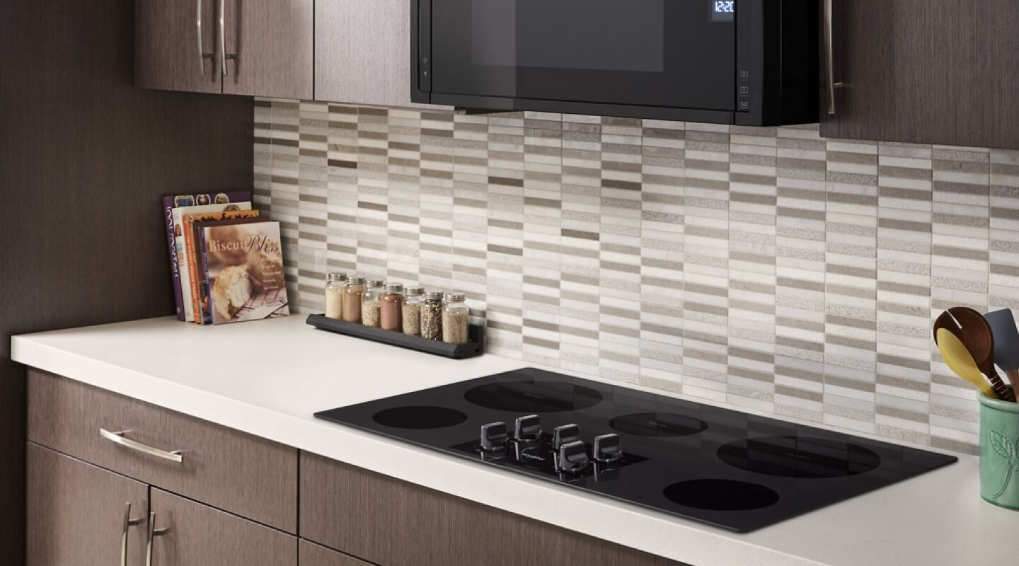 Electric cooktop on a white kitchen counter