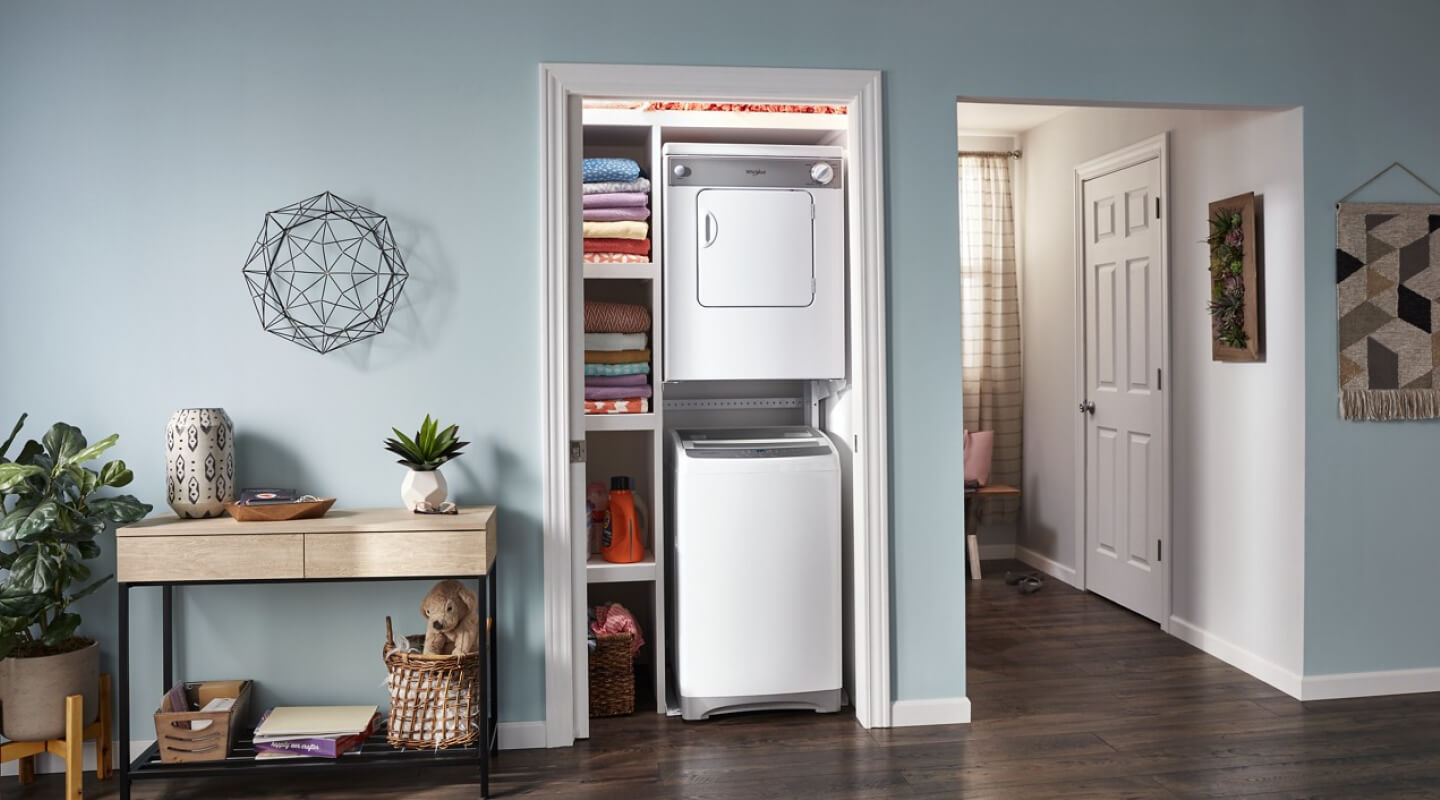 Stacked laundry center in a closet
