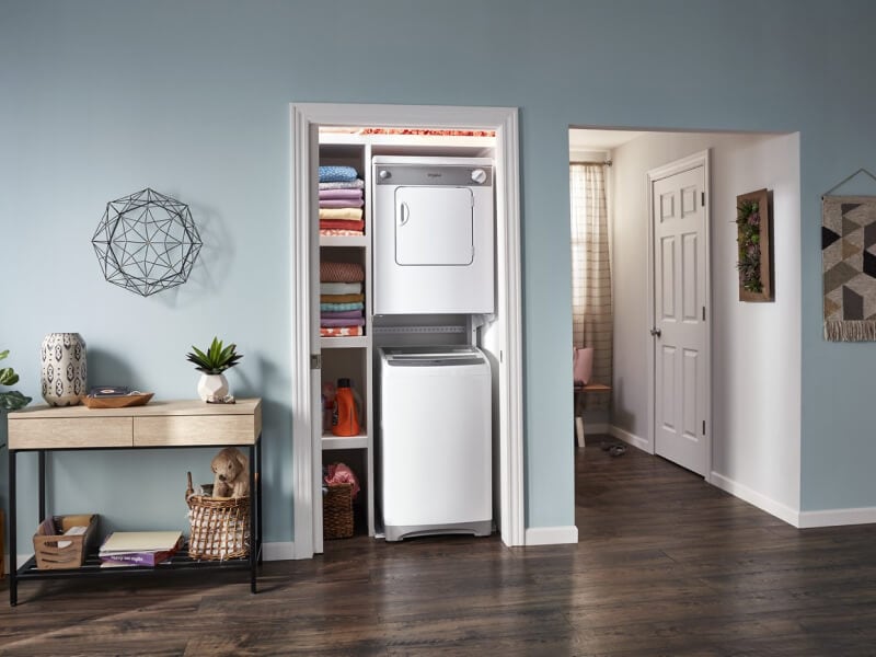 Stacked laundry center in a closet