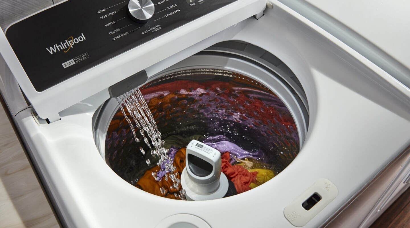 Top load washer filled with laundry