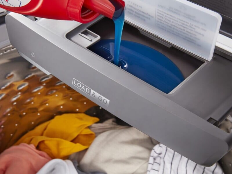 Laundry detergent being poured into a Whirlpool® Load & Go™ Dispenser