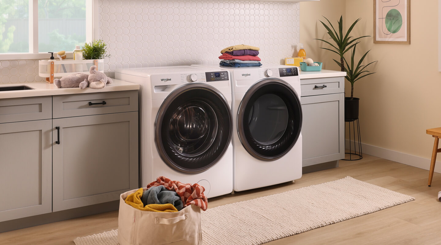 A Whirlpool® Front Load Washer and Dryer pair in a laundry room