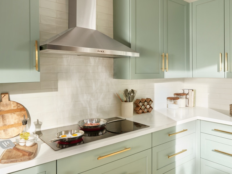 Eggs and bacon cooking under a range hood Eggs and bacon cooking under a range hood