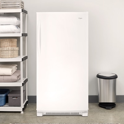 Upright freezer in a garage