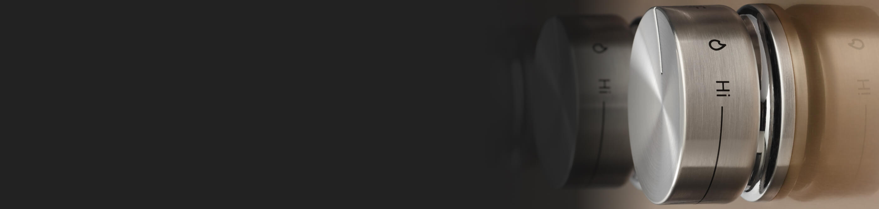 Close-up of kitchen range burner knobs