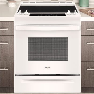 White Whirlpool® range set in cabinetry