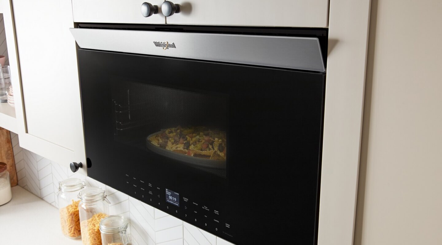 Whirlpool® Microwave with food cooking inside