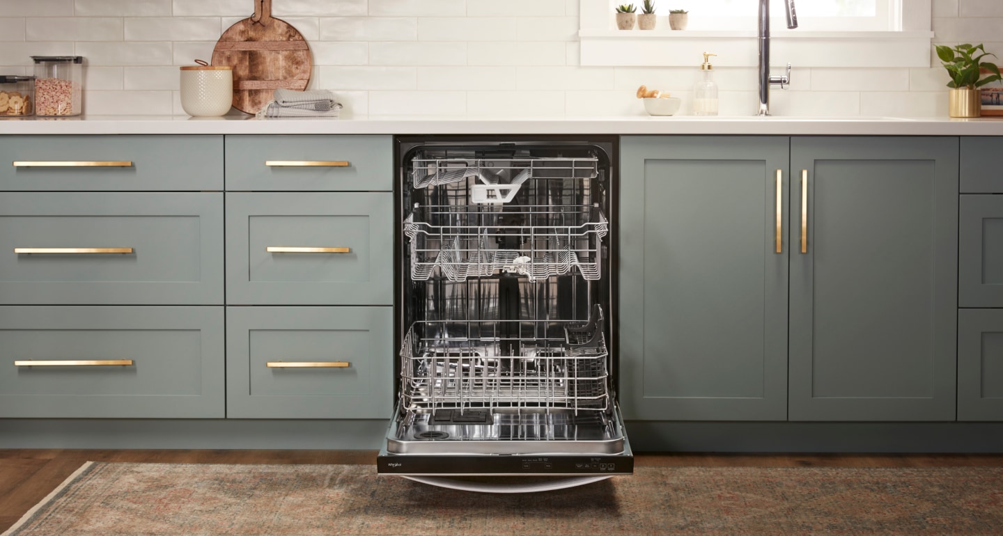 An opened dishwasher with a third rack