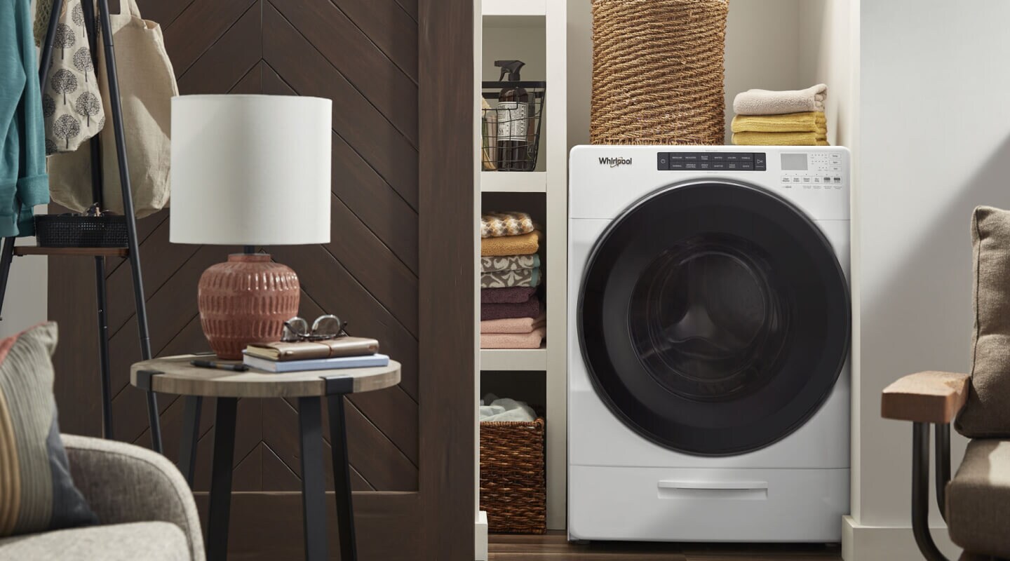 A Whirlpool® All-In-One Washer Dryer Combo in a closet 