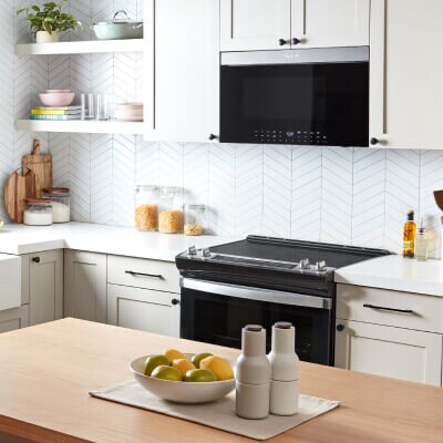 A microwave mounted above a range