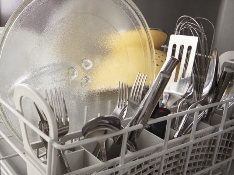 Dishes loaded in the lower rack of a dishwasher Dishes loaded in the lower rack of a dishwasher