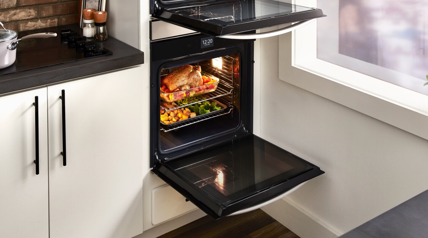 A double wall oven featuring elaborate dishes on two racks