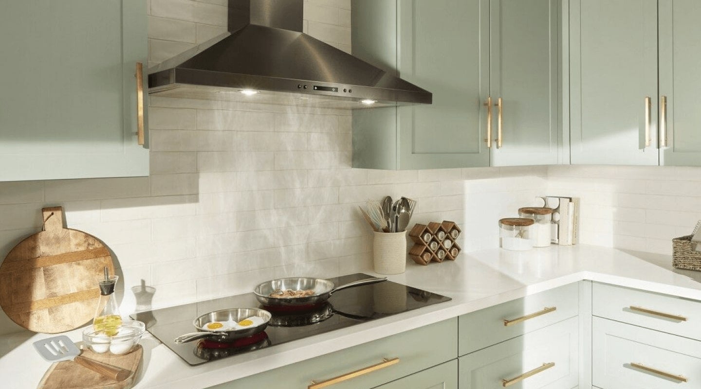 A range hood collecting steam from cooked eggs and bacon