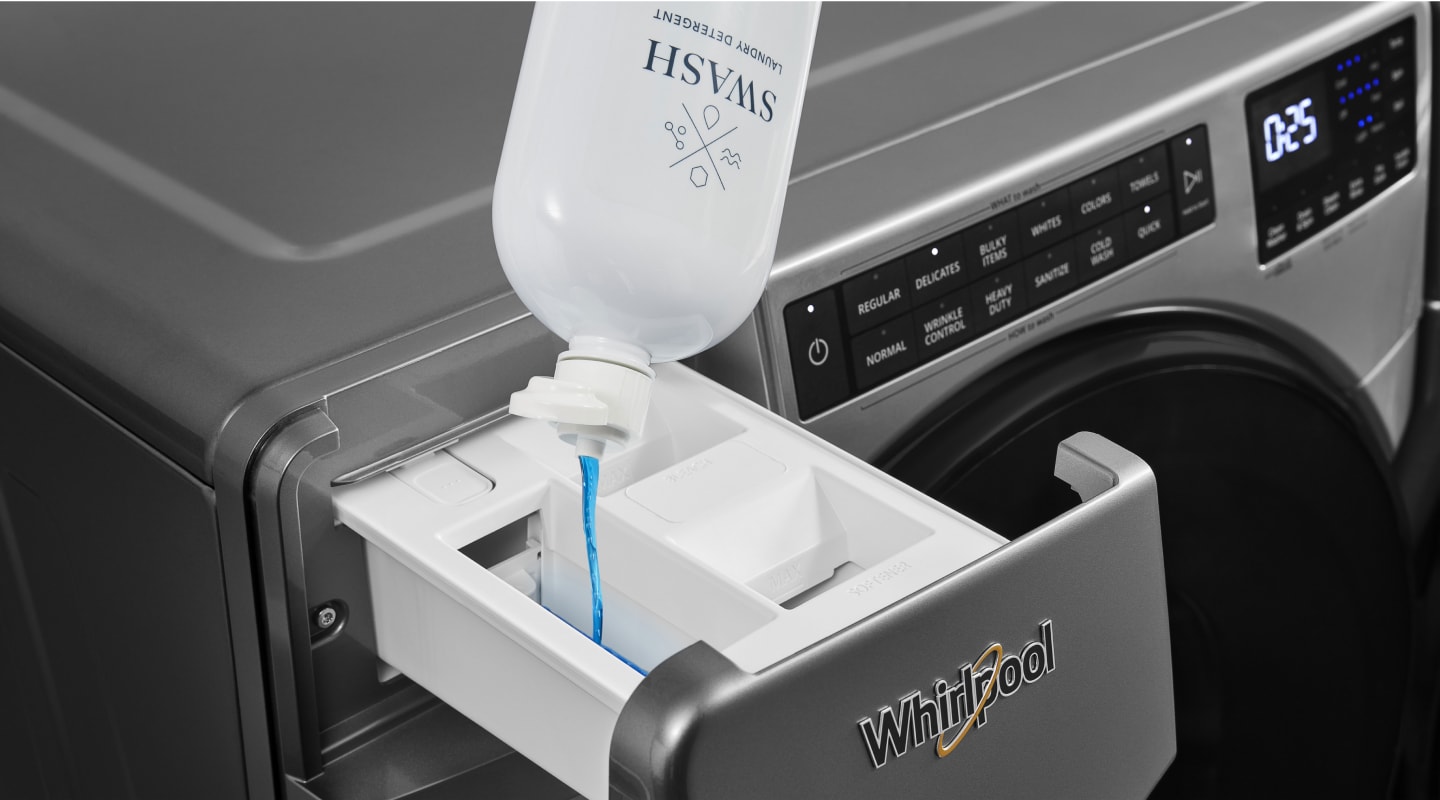 Swash® laundry detergent poured into the dispenser drawer of a Whirlpool® washing machine Swash® laundry detergent poured into the dispenser drawer of a Whirlpool® washing machine