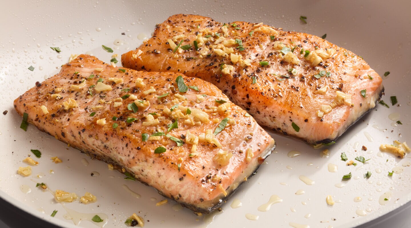 Two seasoned salmon fillets on a plate Two seasoned salmon fillets on a plate